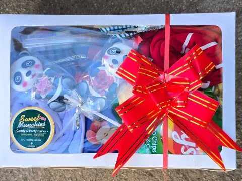 Premium Box in a white gift box finished with a satin bow